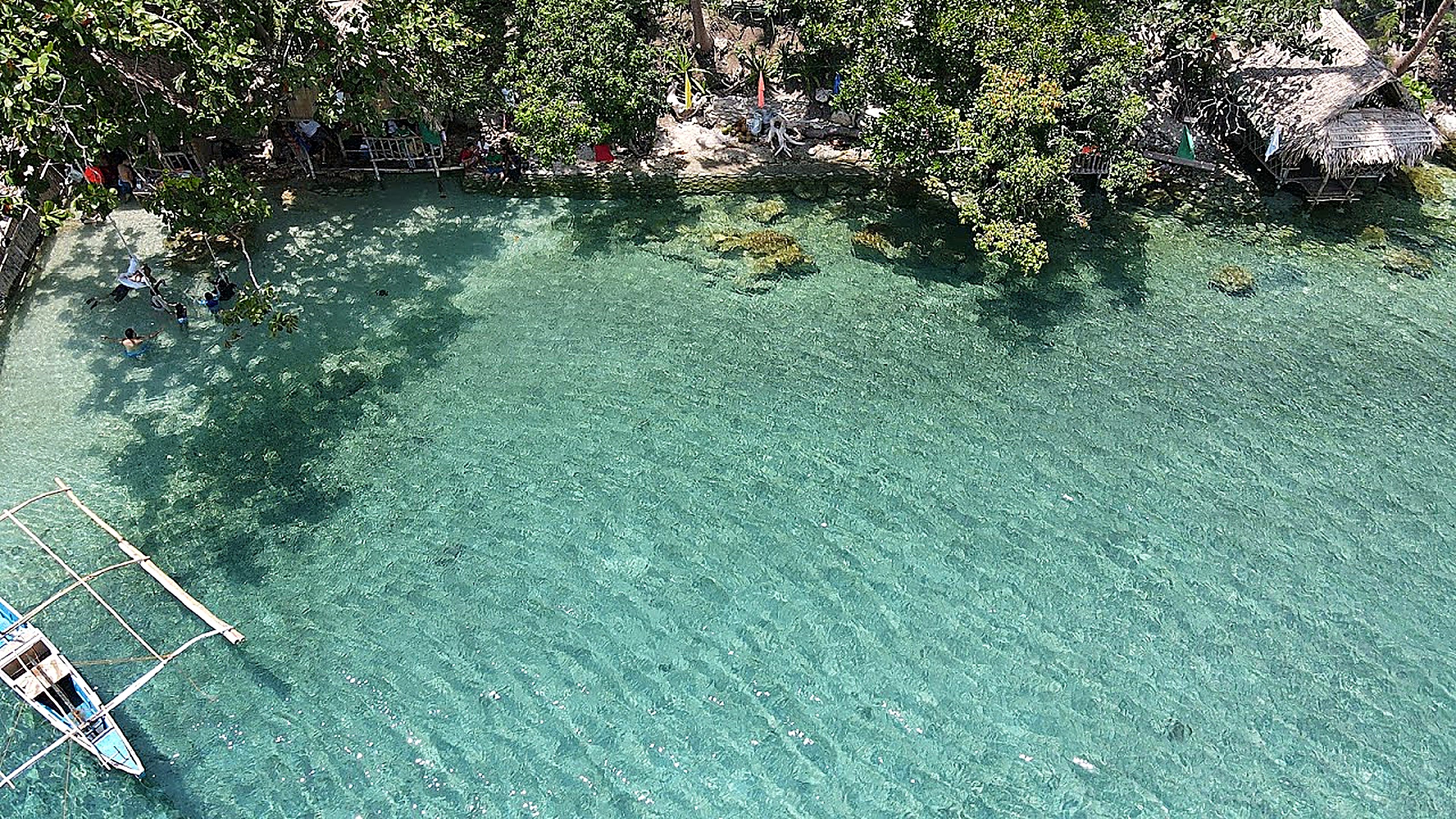 The floating cottage with slide and diving board at Crystal Blue Dive, Gasgas Beach, Mogpog